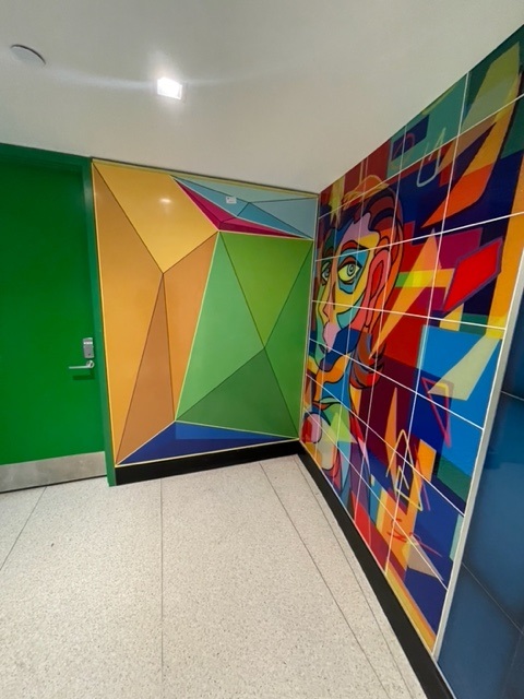 Colourful, abstract BioCarbon Laminates mounted on the walls as part of a prestigious JFK airport project in New York, United States of America.